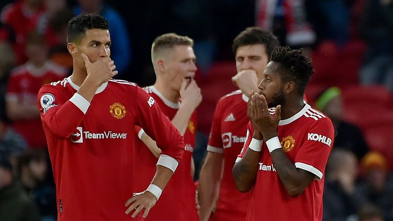 Cristiano Ronaldo, Manchester United, left, and Fred talk on the field at the start of the second half during the Premier League soccer match between Manchester United and Liverpool at Old Trafford in Manchester, England, Sunday, October 24, 2021 (AP Photo/Rui Vieira )