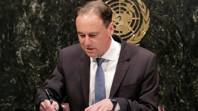 Greg Hunt, Australia's Minister of the Environment, signs the Paris Agreement on climate change, Friday, April 22, 2016 at U.N. headquarters. (AP Photo/Mark Lennihan)