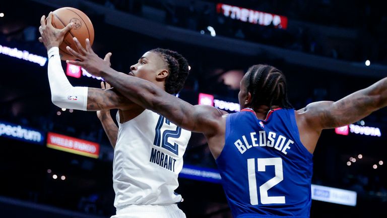 Memphis Grizzlies guard Ja Morant goes to the basket as Los Angeles Clippers guard Eric Bledsoe defends