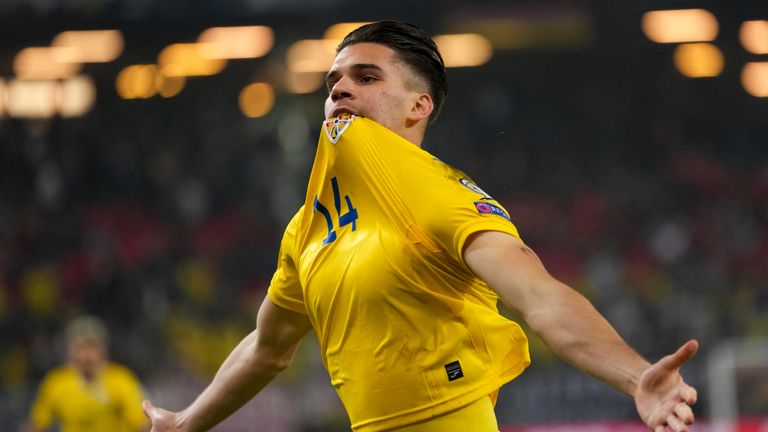 Ianis Hagi celebrates during the World Cup 2022 group J qualifying soccer match between Germany and Romania in Hamburg, Germany, Friday, Oct. 8, 2021. (AP Photo/Michael Sohn)