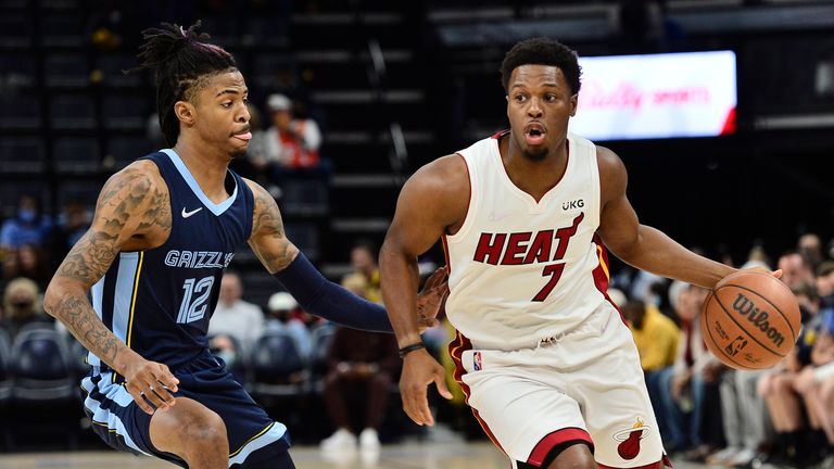 Miami Heat guard Kyle Lowry (7) works against Memphis Grizzlies guard Ja Morant (12) during the first half of an NBA basketball game Saturday, Oct. 30, 2021, in Memphis, Tenn. (AP Photo/Brandon Dill)


