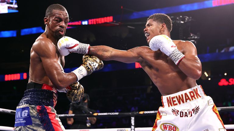 ATLANTA, GEORGIA - OCTOBER 23: Jamel Herring (L) and Shakur Stevenson (R) exchange punches during their fight for the WBO world junior lightweight championship fight at State Farm Arena on October 23, 2021 in Atlanta, Georgia.(Photo by Mikey Williams/Top Rank Inc via Getty Images).