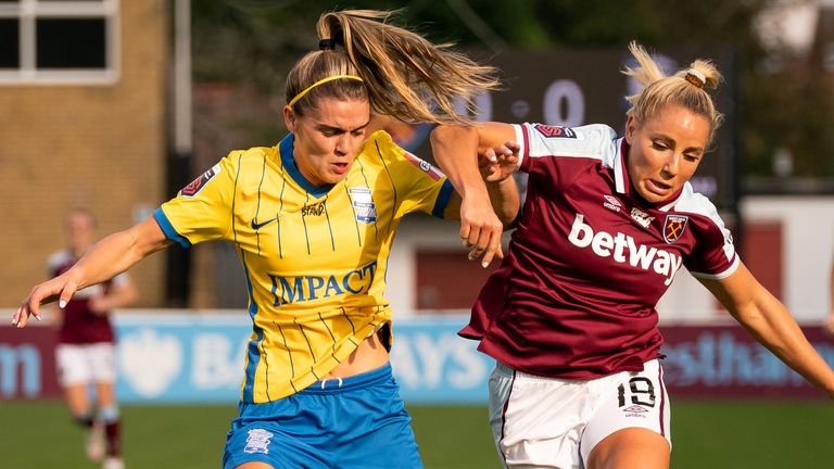 Jamie Finn and West Ham United's Adrina Leon battle for the ball 