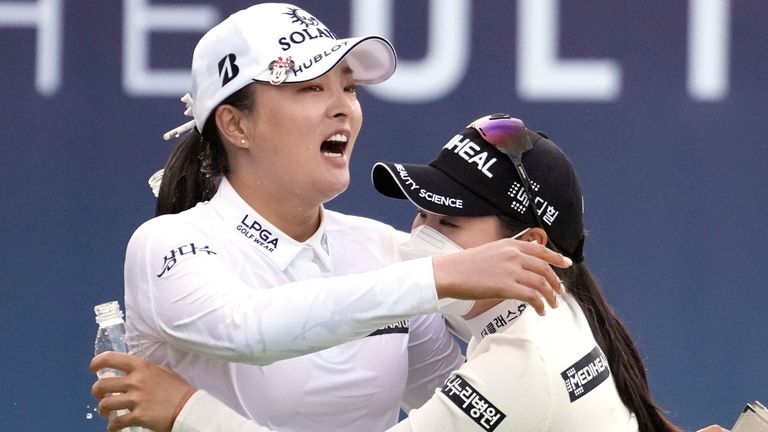 Jin Young Ko of South Korea, left, celebrates with other player after winning at the 18th hole during the final round of the BMW Ladies Championship at LPGA International Busan in Busan, South Korea, Sunday, Oct. 24, 2021. (AP Photo/Lee Jin-man)