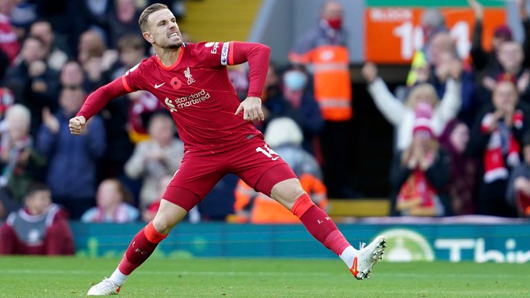 Jordan Henderson celebrates after scoring Liverpools opener (AP)