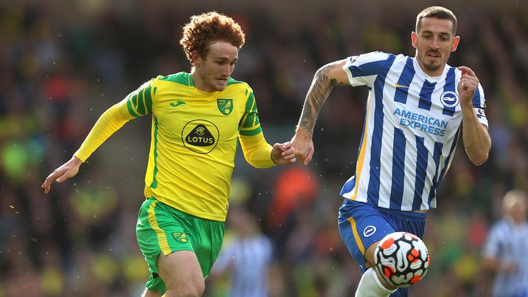 Josh Sargent of Norwich City battle for possession with Lewis Dunk of Brighton