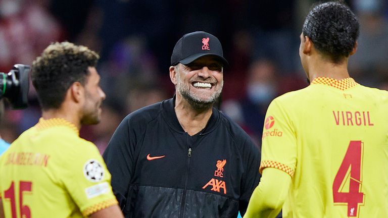 Jurgen Klopp celebrates with Virgil van Dijk following Liverpool&#39;s victory in Spain