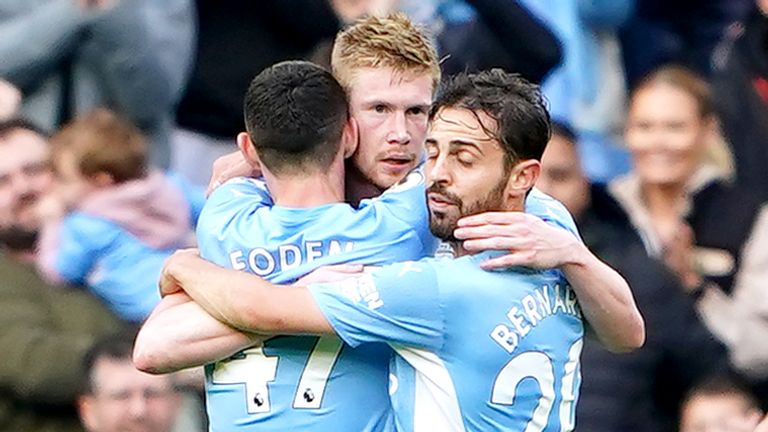 Kevin De Bruyne embraces teammates after scoring Man City's second goal
