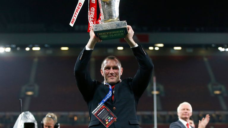 Picture by Ed Sykes/SWpix.com - 09/10/2021 - Rugby League - Betfred Super League Grand Final - Catalans Dragons v St Helens - Old Trafford, Manchester, England - St Helens head coach Kristian Woolf celebrates with the trophy after the game