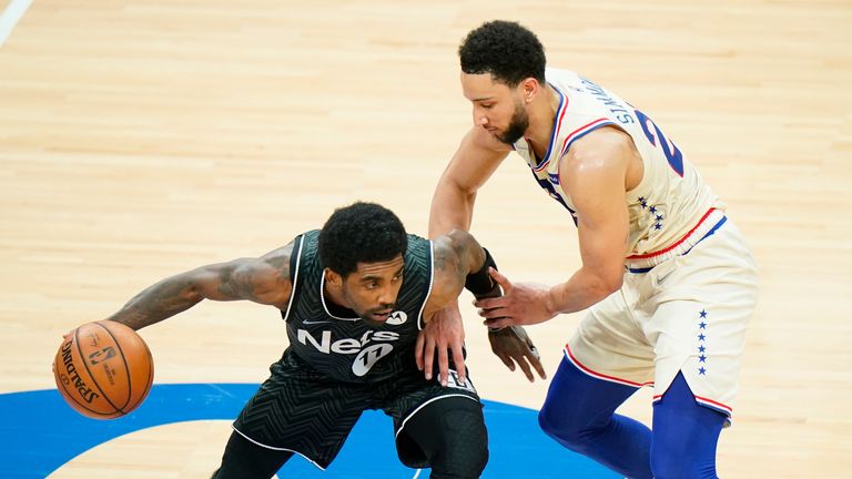 Brooklyn Nets&#39; Kyrie Irving tries to get past Philadelphia 76ers&#39; Ben Simmons