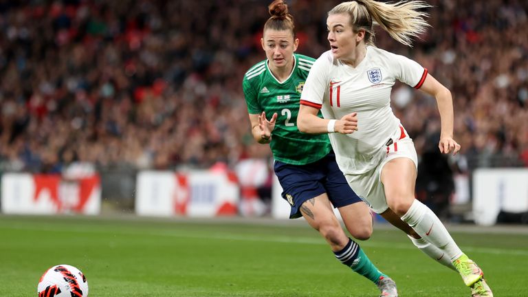 England&#39;s Lauren Hemp runs with the ball under pressure from Rebecca McKenna of Northern Ireland