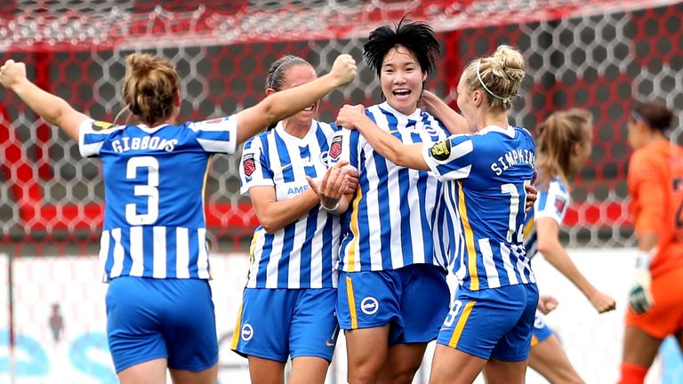 Brighton's Lee Geum-min celebrates with her team-mates 