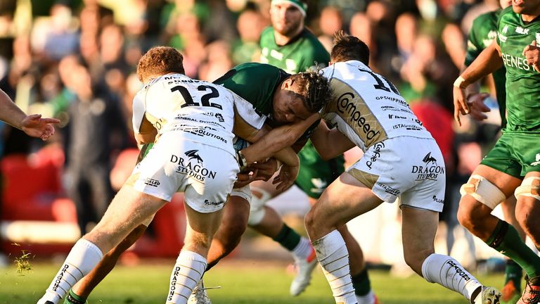 Connacht's Leva Fifita in action against Aneurin Owen, left, and Sam Davies of Dragons