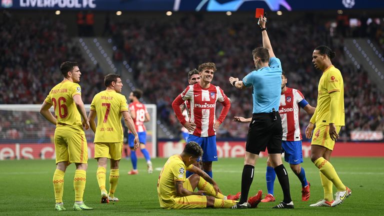 Antoine Griezmann is shown a red card for his high challenge on Roberto Firmino