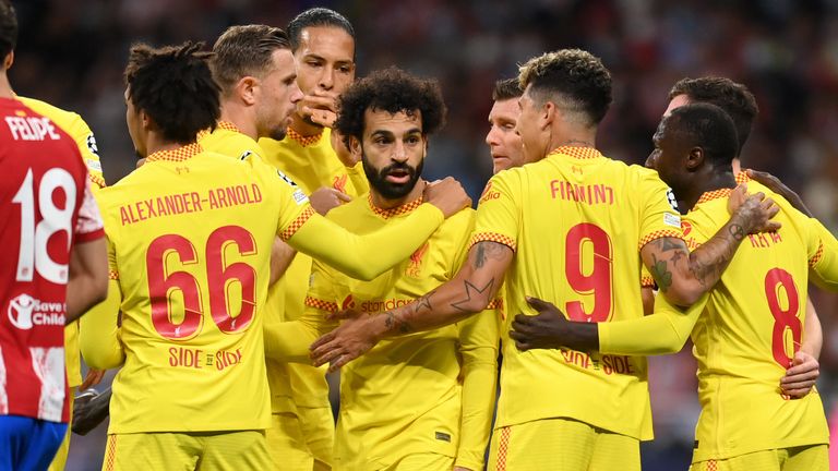 Liverpool players celebrate after taking the lead against Atletico Madrid