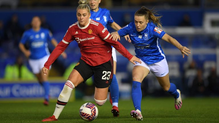 Alessia Russo of Manchester United is challenged by Harriet Scott of Birmingham City