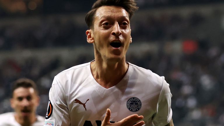 Mesut Ozil of Fenerbahce celebrates after scoring their side's first goal during the UEFA Europa League group D match between Eintracht Frankfurt and Fenerbahce at Deutsche Bank Park on September 16, 2021 in Frankfurt