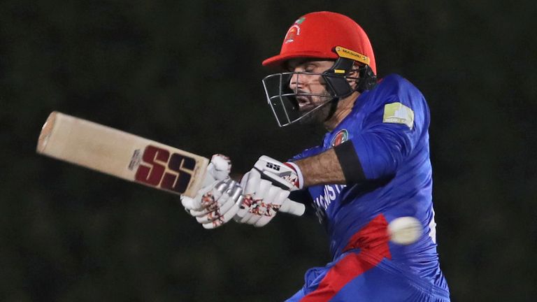 Afghanistan's captain Mohammad Nabi plays a shot during the Cricket Twenty20 World Cup warm-up match between Afghanistan and West Indies in Dubai
