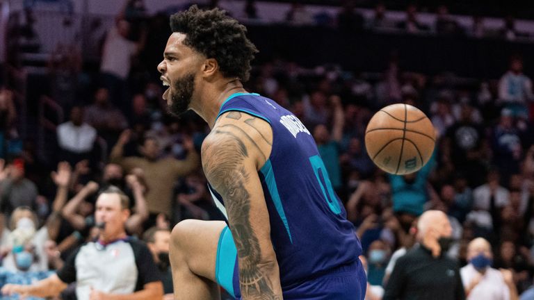 Charlotte Hornets forward Miles Bridges (0) reacts after a dunk against the Boston Celtics during an NBA basketball game in Charlotte, N.C., Monday, Oct. 25, 2021.