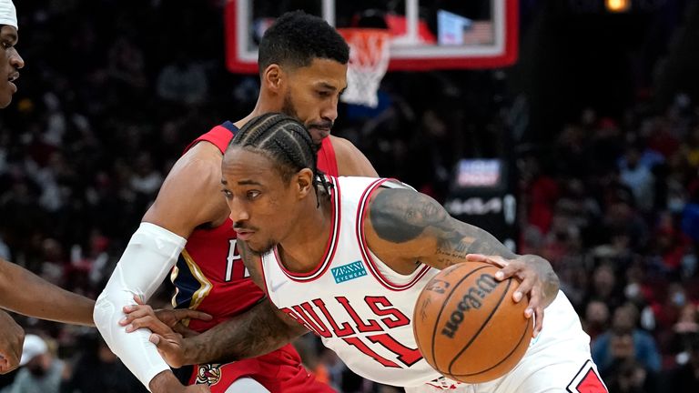 Chicago Bulls forward DeMar DeRozan, right, drives against New Orleans Pelicans forward Garrett Temple during the first half of an NBA basketball game in Chicago, Friday, Oct. 22, 2021. (AP Photo/Nam Y. Huh)


