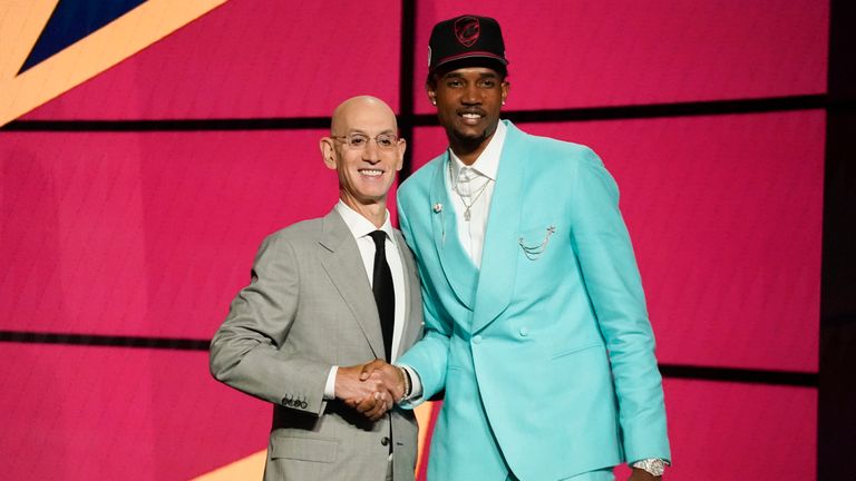 Evan Mobley, right, poses for a photo with NBA Commissioner Adam Silver after being selected third overall by the Cleveland Cavaliers during the NBA basketball draft, Thursday, July 29, 2021, in New York. (AP Photo/Corey Sipkin)



