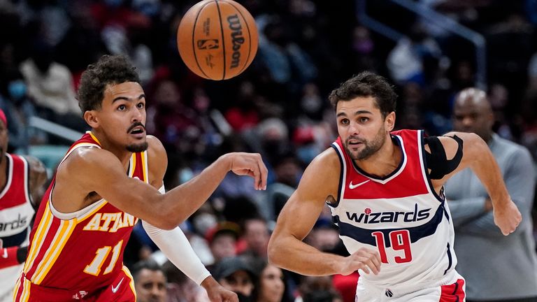 Atlanta Hawks guard Trae Young (11) steals the ball from Washington Wizards guard Raul Neto (19) during the second half of an NBA basketball game Thursday, Oct. 28, 2021, in Washington. The Wizards won 122-111.