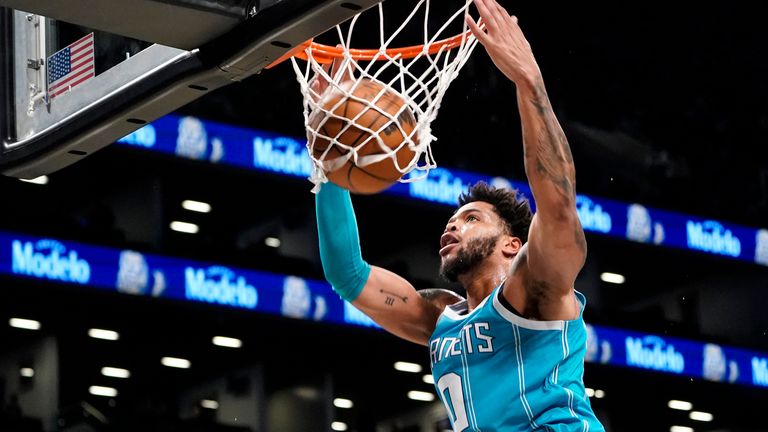 Charlotte Hornets forward Miles Bridges dunks during the first half of an NBA basketball game against the Brooklyn Nets, Sunday, Oct. 24, 2021, in New York.