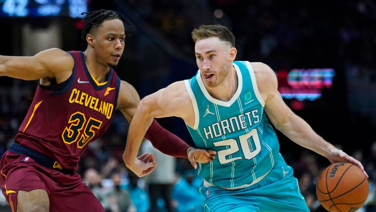 Charlotte Hornets&#39; Gordon Hayward (20) drives against Cleveland Cavaliers&#39; Isaac Okoro (35) in the second half of an NBA basketball game, Friday, Oct. 22, 2021, in Cleveland. (AP Photo/Tony Dejak)


