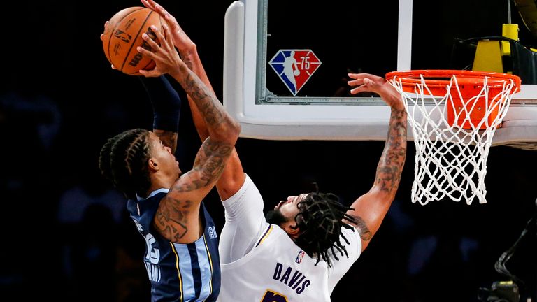 Anthony Davis meets Ja Morant at the rim during their game on Sunday night