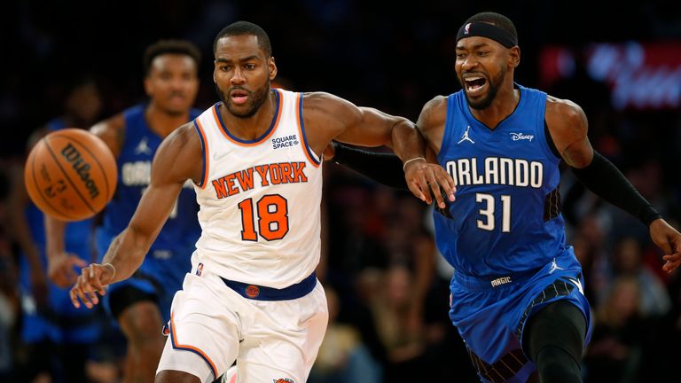 New York Knicks&#39; Alex Burks (18) chases down the ball next to Orlando Magic&#39;s Terrence Ross (31) during an NBA basketball game Sunday, Oct. 24, 2021, in New York. 
