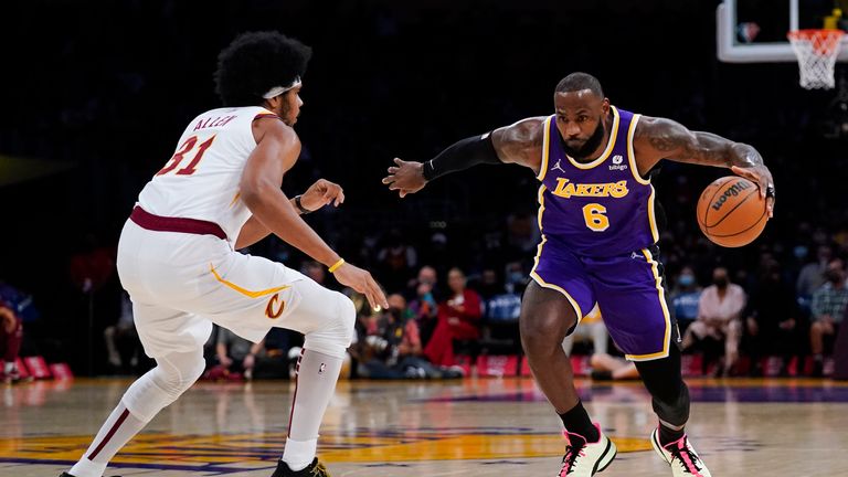 Los Angeles Lakers&#39; LeBron James, right, drives around Cleveland Cavaliers&#39; Jarrett Allen during the first half of an NBA basketball game Friday, Oct. 29, 2021, in Los Angeles. (AP Photo/Jae C. Hong)


