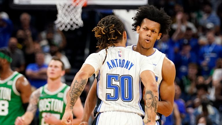 Orlando Magic&#39;s Jeff Dowtin, right, celebrates after shooting the game winning shot against the Boston Celtics with teammate Cole Anthony (50) during the second half of an NBA preseason basketball game, Wednesday, Oct. 13, 2021, in Orlando, Fla. (AP Photo/John Raoux)


