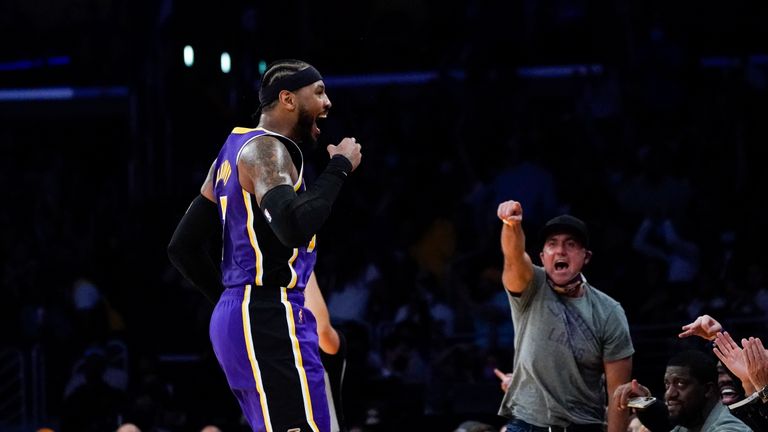 Los Angeles Lakers&#39; Carmelo Anthony celebrates his 3-point basket against the Cleveland Cavaliers during the second half of an NBA basketball game Friday, Oct. 29, 2021, in Los Angeles. (AP Photo/Jae C. Hong)


