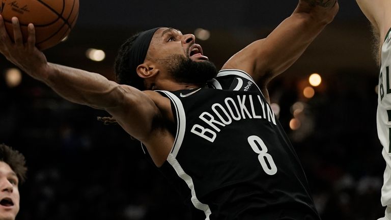 Brooklyn Nets&#39; Patty Mills tries to shoot past Milwaukee Bucks&#39; Pat Connaughton during the second half of an NBA basketball game Tuesday, Oct. 19, 2021, in Milwaukee. (AP Photo/Morry Gash)


