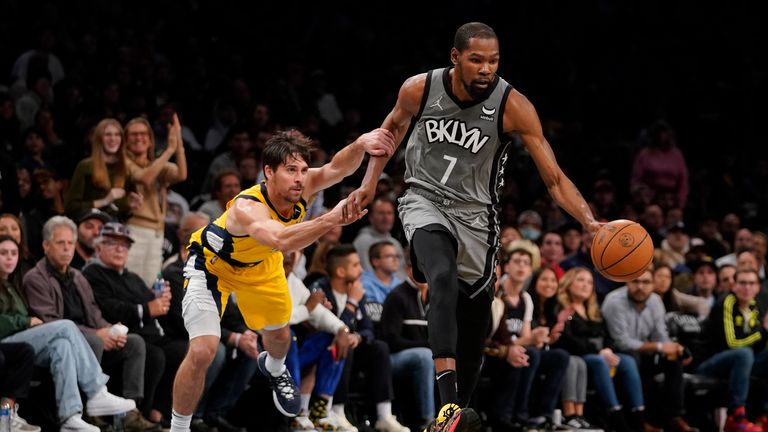 Brooklyn Nets forward Kevin Durant (7) drives against Indiana Pacers guard T.J. McConnell during the second half of an NBA basketball game, Friday, Oct. 29, 2021, in New York. The Nets won 105-98. (AP Photo/Mary Altaffer)


