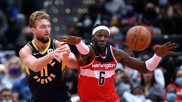 Indiana Pacers forward Domantas Sabonis (11) passes the ball away from Washington Wizards center Montrezl Harrell (6) during the second half of an NBA basketball game, Friday, Oct. 22, 2021, in Washington. The Wizards won 135-134 in overtime. (AP Photo/Nick Wass)


