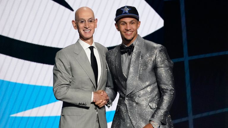 Jalen Suggs, right, poses for a photo with NBA Commissioner Adam Silver after being selected fifth overall by the Orlando Magic during the first round of the NBA basketball draft, Thursday, July 29, 2021, in New York. (AP Photo/Corey Sipkin)


