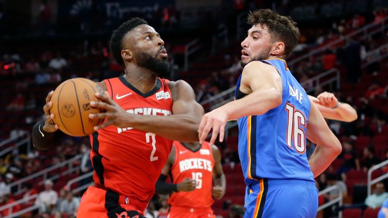 Houston Rockets forward David Nwaba (2) drives to the basket as Oklahoma City Thunder guard Ty Jerome (16) defends during the second half of an NBA basketball game Friday, Oct. 22, 2021, in Houston. (AP Photo/Michael Wyke)


