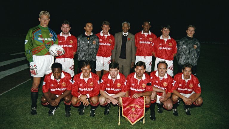 The Manchester United team pictured with Nelson Mandela during the team's tour of South Africa