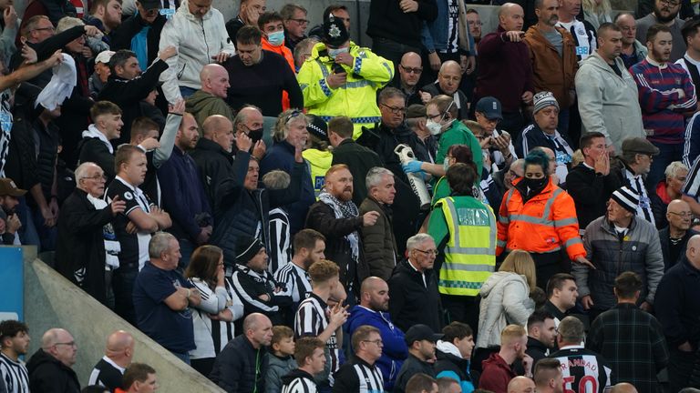 PA - Medical teams assist a fan who suffered a suspected cardiac arrest in the stands during Newcastle&#39;s game against Tottenham