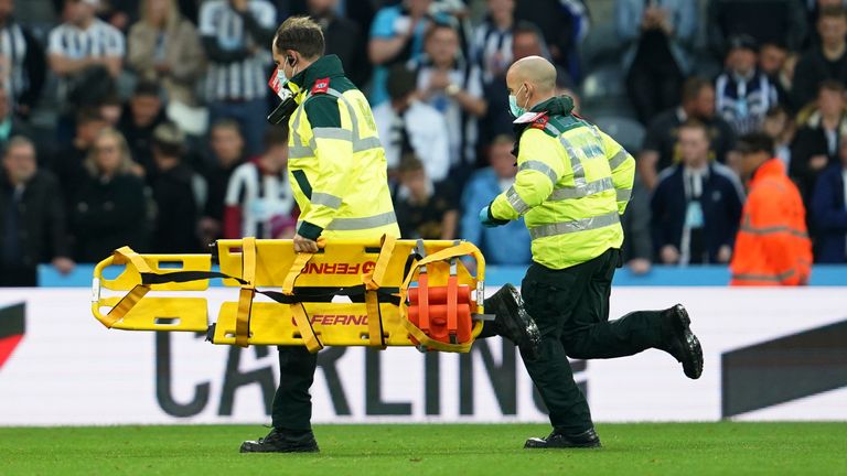 Medical teams assisted a fan at St James' Park during Newcastle United's game against Tottenham.