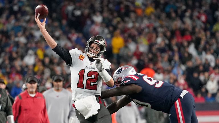 Tampa Bay Buccaneers quarterback Tom Brady (12) throws while pressured by New England Patriots defensive tackle Christian Barmore (90) during the second half of an NFL football game, Sunday, Oct. 3, 2021, in Foxborough, Mass. (AP Photo/Steven Senne)


