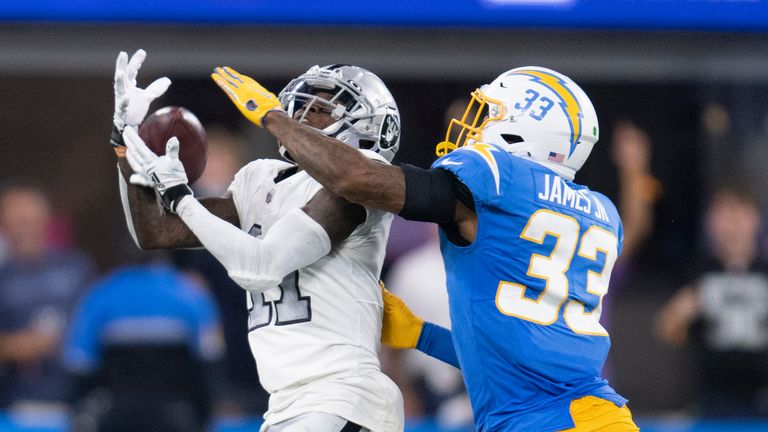 Las Vegas Raiders wide receiver Henry Ruggs III (11), left, catches a pass over Los Angeles Chargers free safety Derwin James (33) during an NFL football game Monday, Oct. 4, 2021, in Inglewood, Calif.