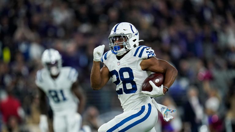 Indianapolis Colts running back Jonathan Taylor runs for a touchdown during the first half of an NFL football game against the Baltimore Ravens, Monday, Oct. 11, 2021, in Baltimore.