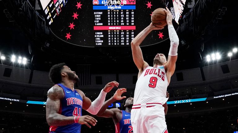Chicago Bulls center Nikola Vucevic goes up to shoot against Detroit Pistons forward Saddiq Bey and center Isaiah Stewart