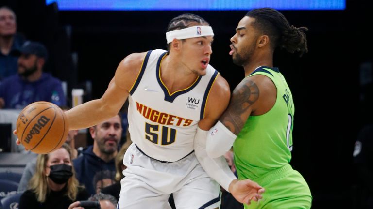 Denver Nuggets forward Aaron Gordon (50) works around the defense of Minnesota Timberwolves guard Anthony Edwards (1) in the first quarter of a NBA basketball game Saturday, Oct. 30, 2021, in Minneapolis. (AP Photo/Bruce Kluckhohn)


