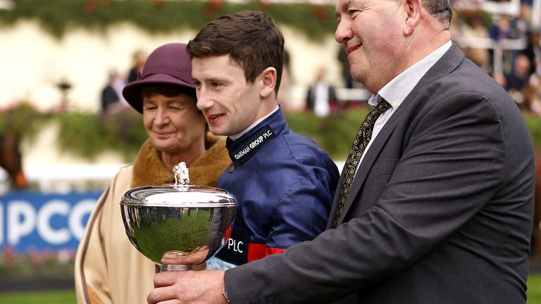 Oisin Murphy holds the trophy after being crowned champion jockey for 2021