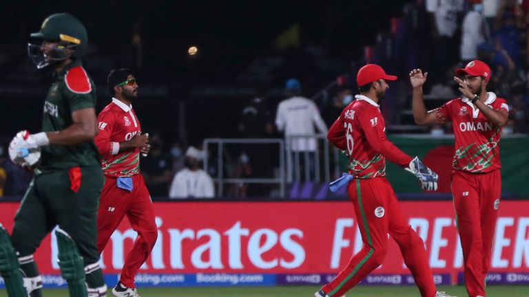 Oman celebrate the wicket of Bangladesh&#39; Shakib Al Hasan at the T20 World Cup