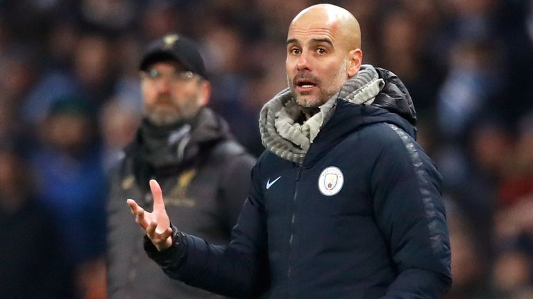 Manchester City manager Pep Guardiola (right) and Liverpool manager Jurgen Klopp during the Premier League match at the Etihad Stadium, Manchester.