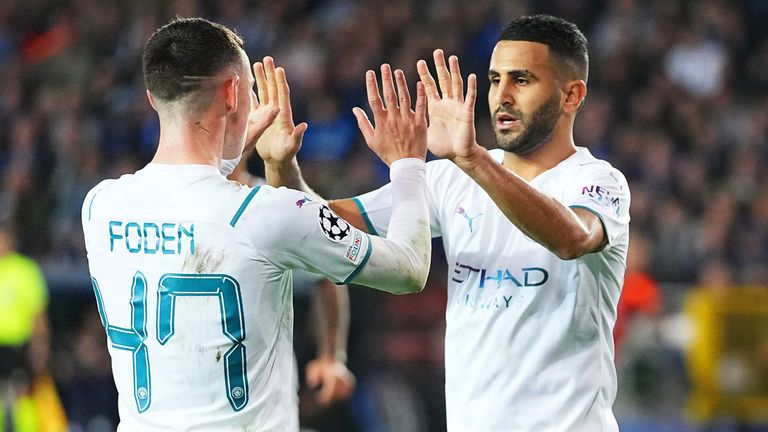 Phil Foden and Riyad Mahrez celebrate in Bruges